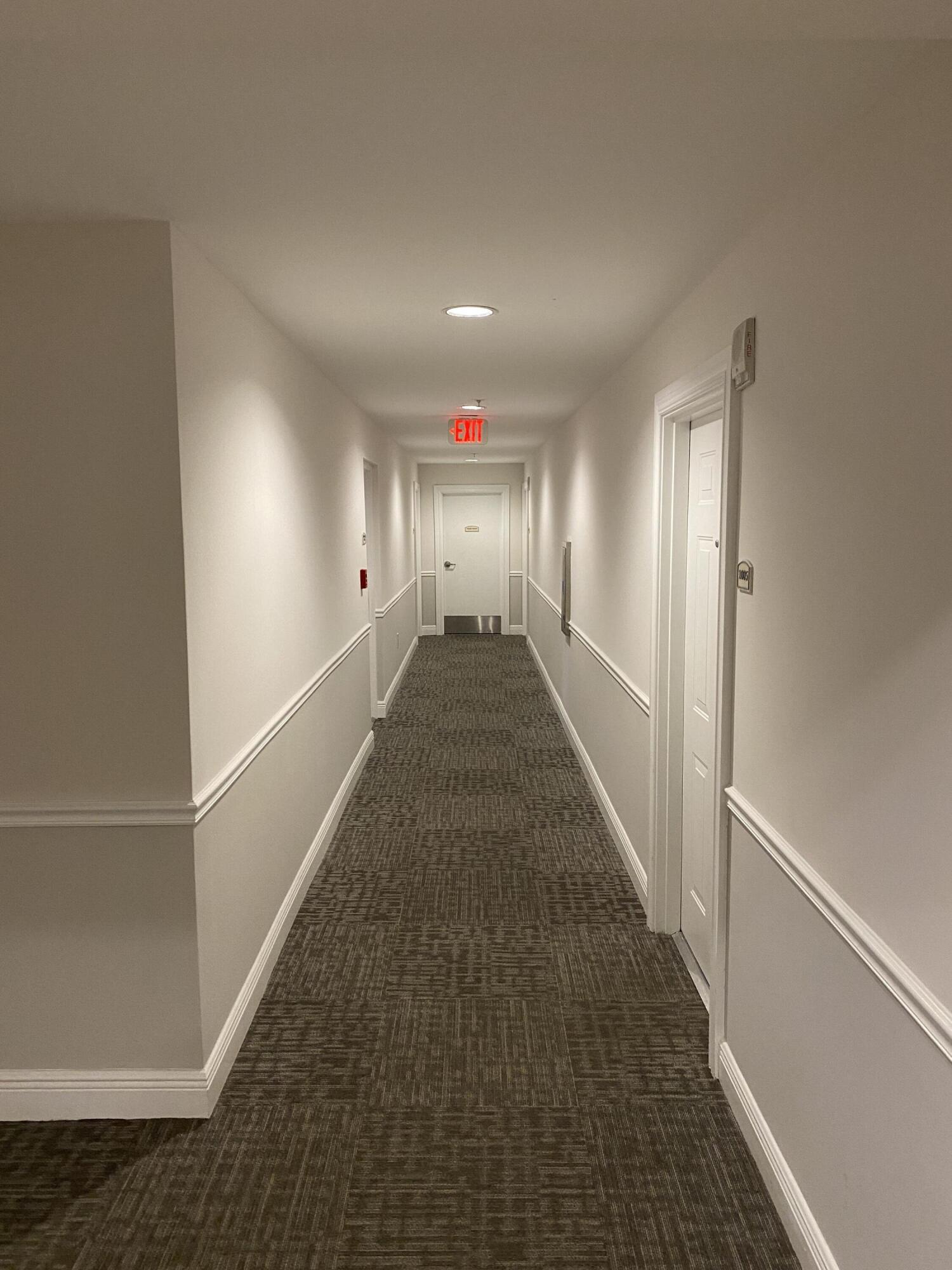 1627 Southwest 37th Avenue, Unit 1003 Miami, FL 33145 - Photo 3 of 12 a view of a hallway with wooden floor