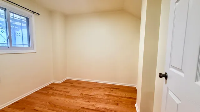 a view of a room with wooden floor and staircase
