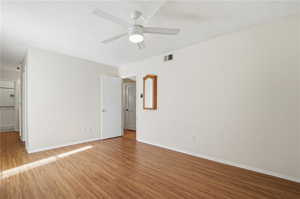 3301 Henderson Mill Road, Unit J1 Atlanta, GA 30341 - Photo 16 of 38 a view of an empty room with wooden floor