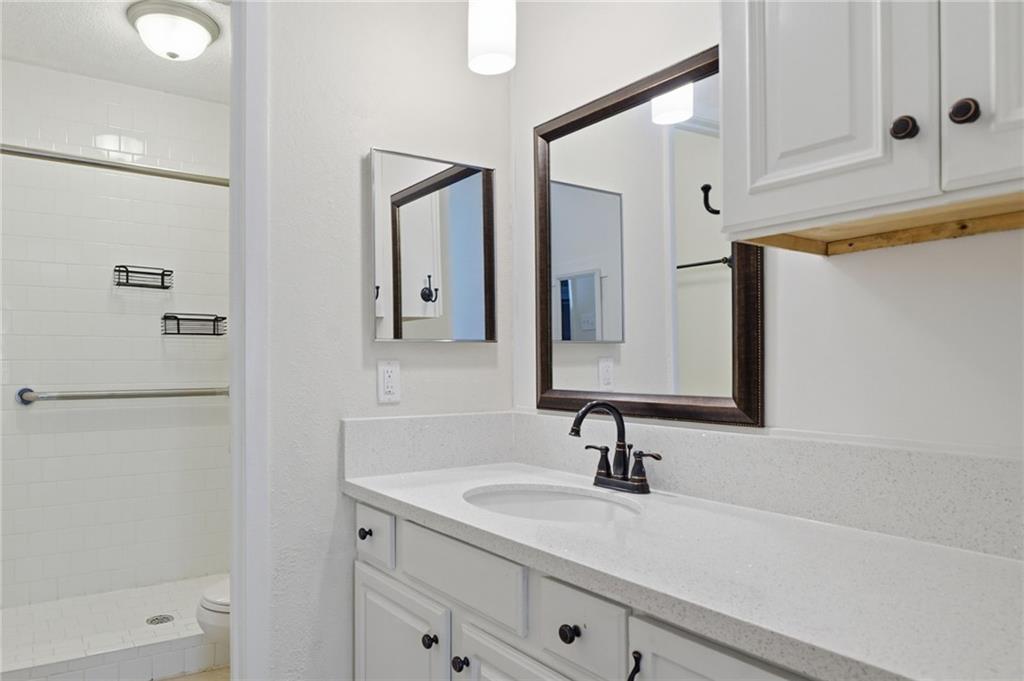 3301 Henderson Mill Road, Unit J1 Atlanta, GA 30341 - Photo 20 of 38 a bathroom with a sink and a mirror
