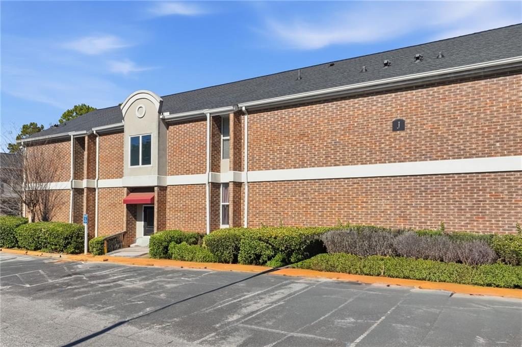 3301 Henderson Mill Road, Unit J1 Atlanta, GA 30341 - Photo 2 of 38 a front view of a house with a yard