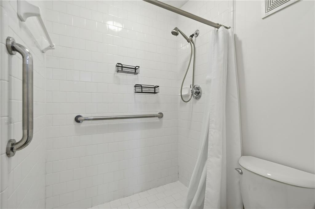 3301 Henderson Mill Road, Unit J1 Atlanta, GA 30341 - Photo 21 of 38 a bathroom with a shower and a shower