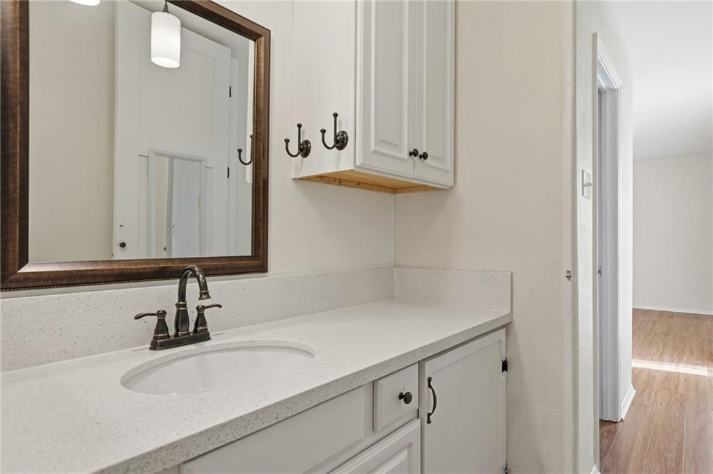 3301 Henderson Mill Road, Unit J1 Atlanta, GA 30341 - Photo 22 of 38 a bathroom with a sink and a mirror