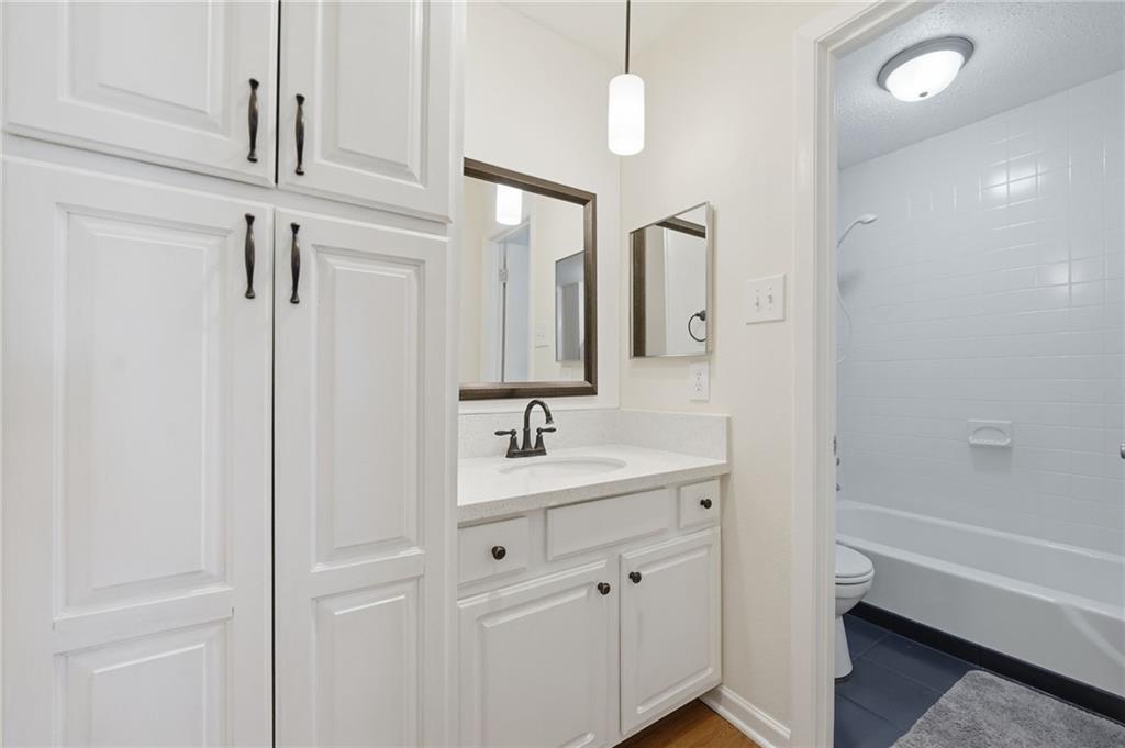 3301 Henderson Mill Road, Unit J1 Atlanta, GA 30341 - Photo 23 of 38 a bathroom with a sink a toilet and shower