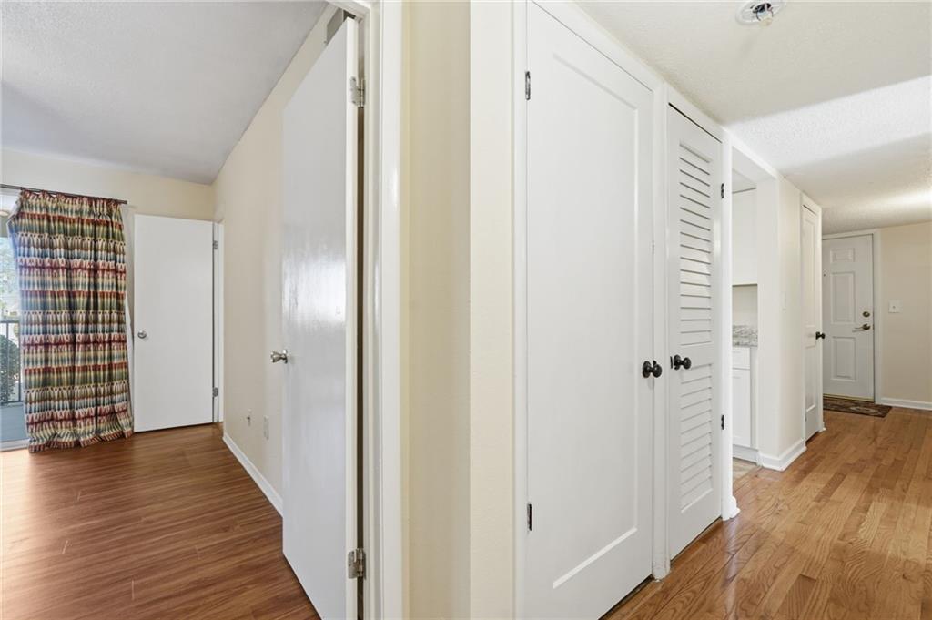 3301 Henderson Mill Road, Unit J1 Atlanta, GA 30341 - Photo 24 of 38 a view of a hallway with wooden floor and closet area