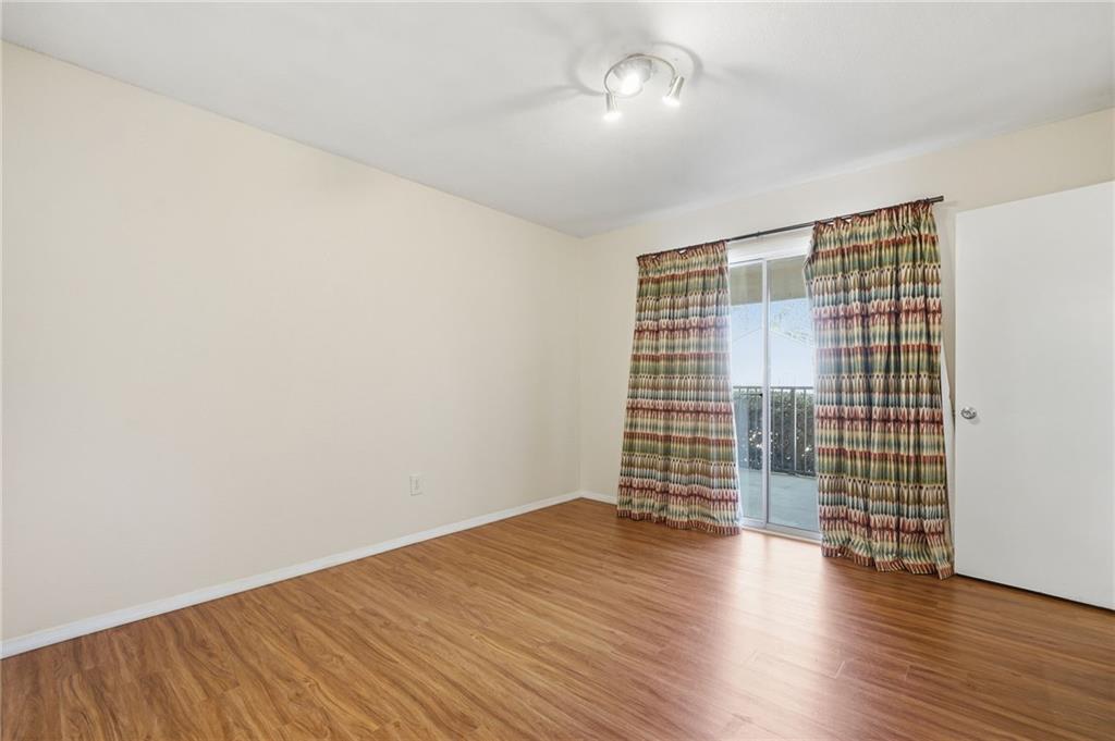 3301 Henderson Mill Road, Unit J1 Atlanta, GA 30341 - Photo 25 of 38 wooden floor in an empty room with a window