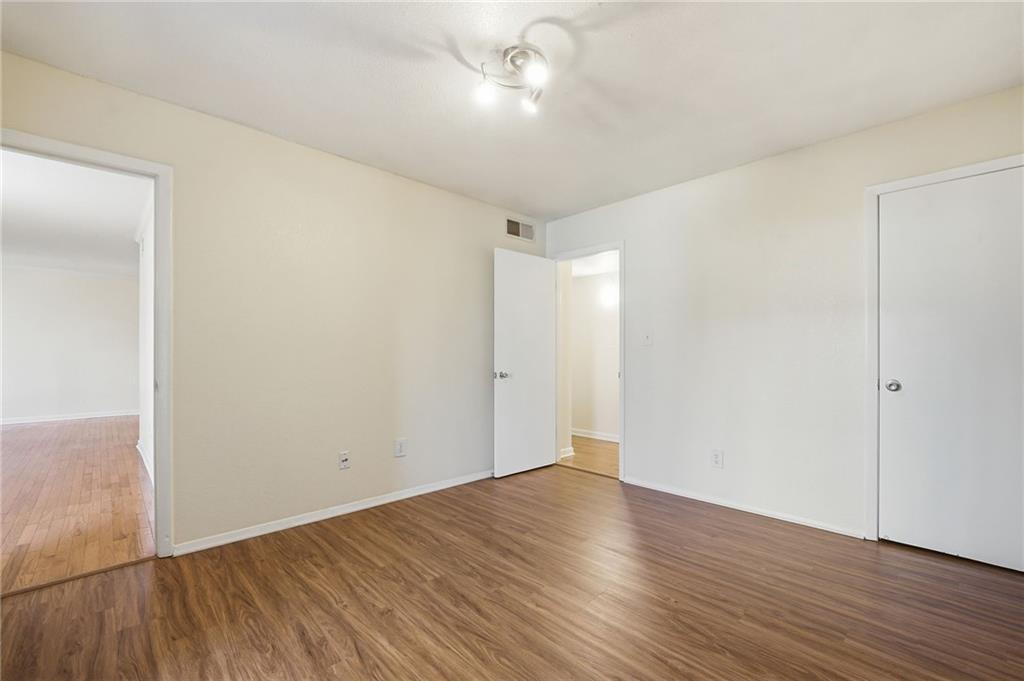 3301 Henderson Mill Road, Unit J1 Atlanta, GA 30341 - Photo 26 of 38 a view of an empty room with wooden floor