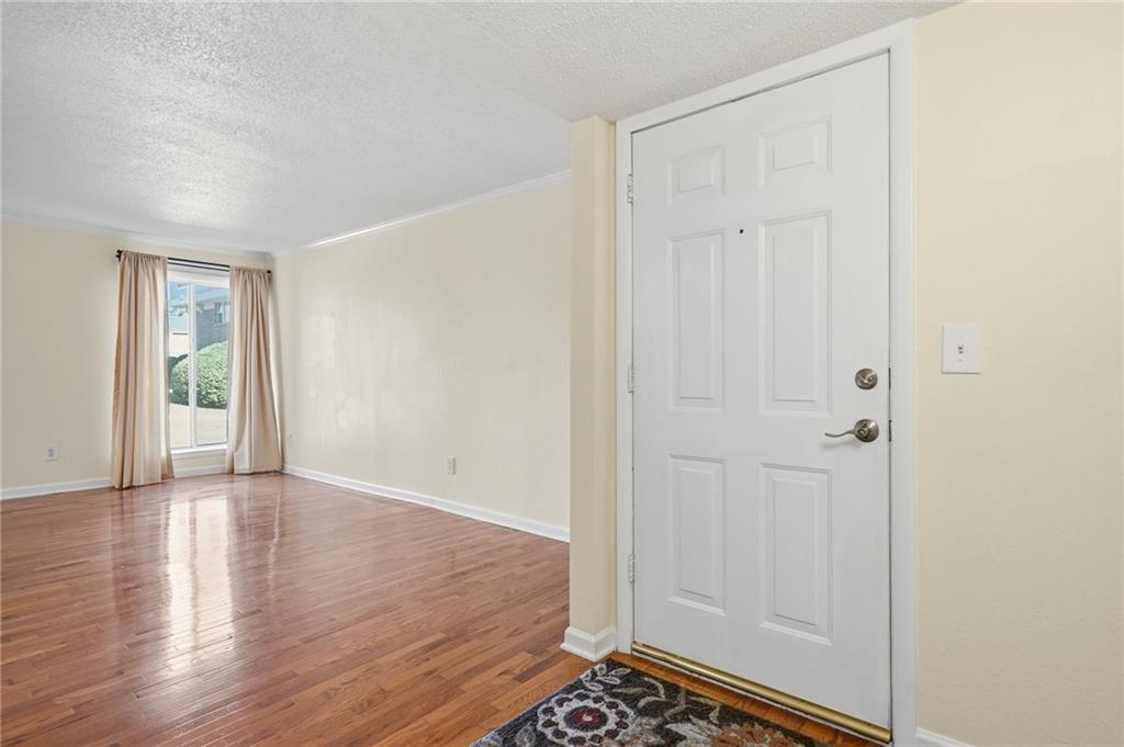 3301 Henderson Mill Road, Unit J1 Atlanta, GA 30341 - Photo 3 of 38 a view of an empty room and wooden floor