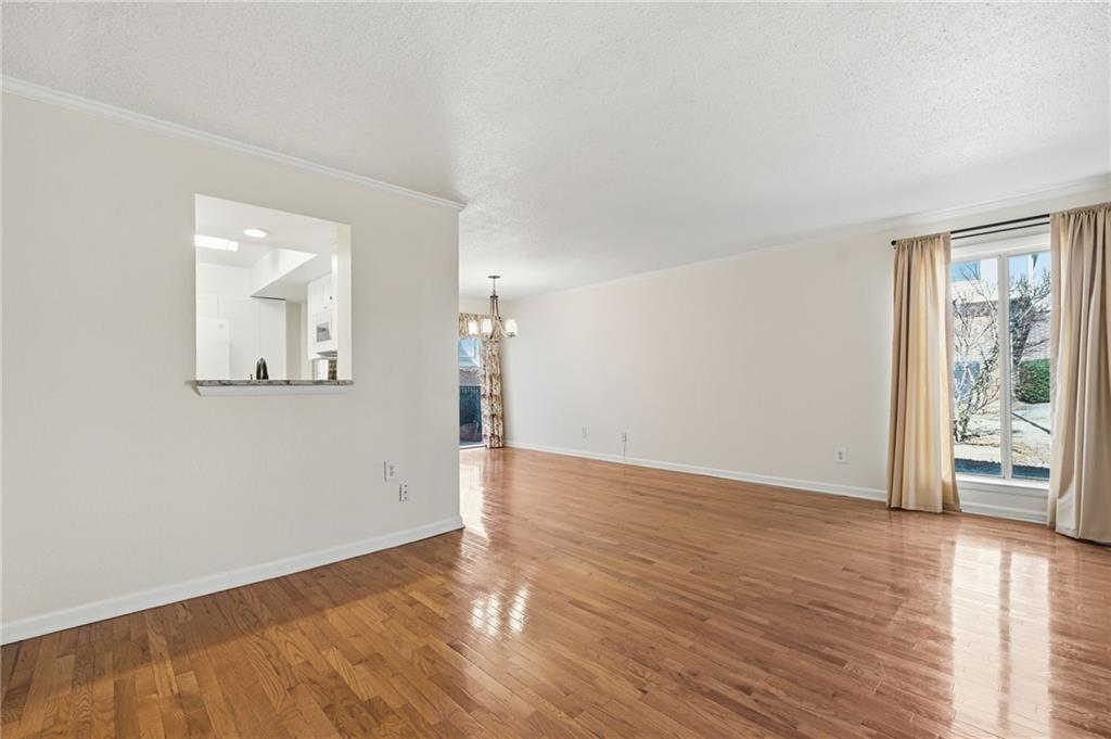 3301 Henderson Mill Road, Unit J1 Atlanta, GA 30341 - Photo 6 of 38 an empty room with wooden floor and windows