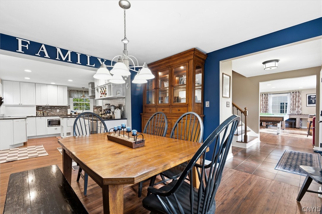 4970 Carnarvon Road Onondaga, NY 13215 - Photo 24 of 50 Elegant dining area filled with natural light.