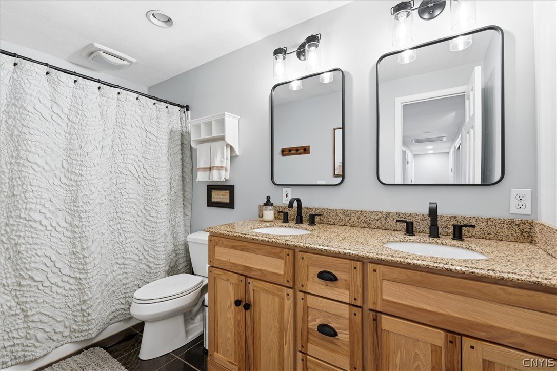 4970 Carnarvon Road Onondaga, NY 13215 - Photo 33 of 50 The second full bathroom is bright, well-maintaine