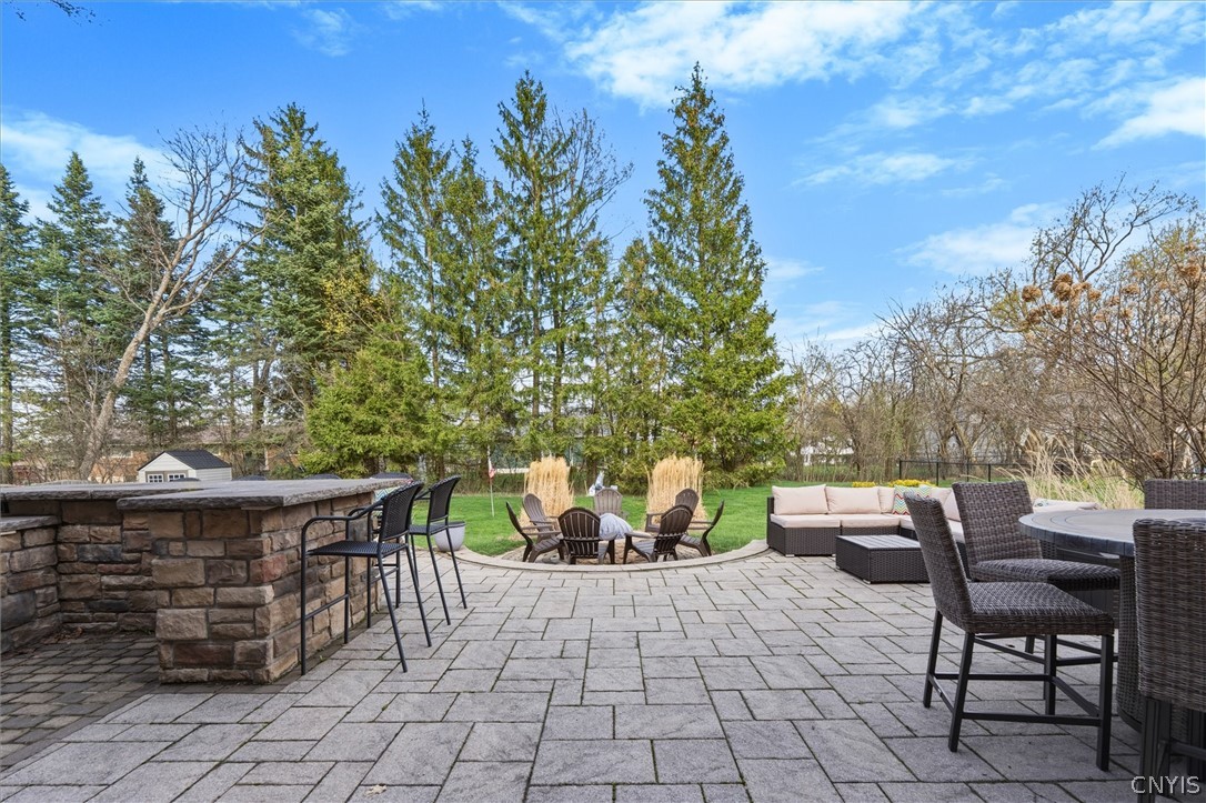 4970 Carnarvon Road Onondaga, NY 13215 - Photo 44 of 50 Custom patio, built-in grill, fire pit, this setup