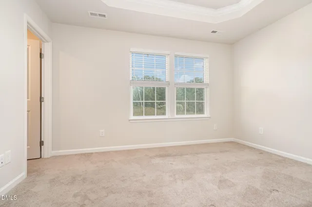 a kitchen with stainless steel appliances granite countertop a stove top oven a sink and a refrigerator