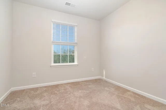an empty room with closet area