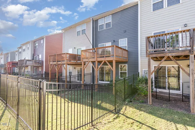 a view of a house with wooden deck