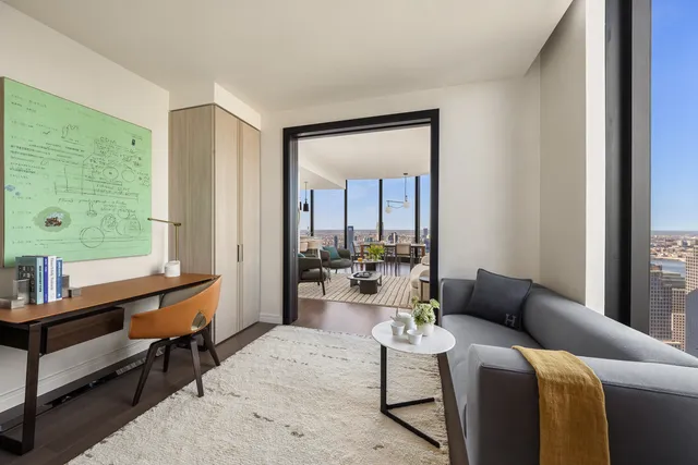 a bedroom with bed and large window