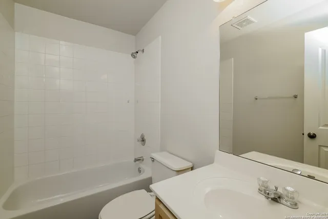 a bathroom with a sink and a toilet