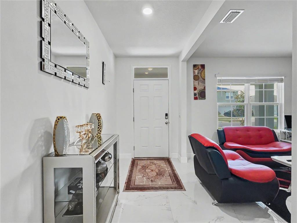2085 Doe Run Drive Davenport, FL 33837 - Photo 6 of 44 a living room with furniture