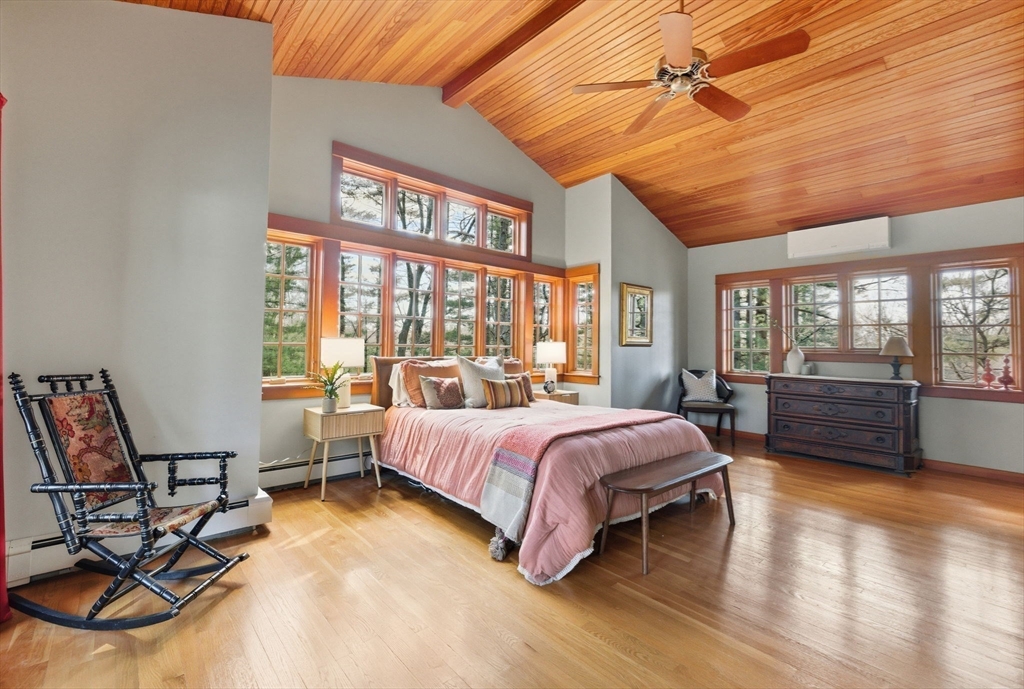 30 Volunteer Way Lexington, MA 02420 - Photo 25 of 41 a spacious bedroom with a bed and large windows
