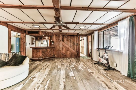 541 South Allen Street Ridgecrest, CA 93555 - Photo 13 of 41 a view of a room with wooden floor and windows
