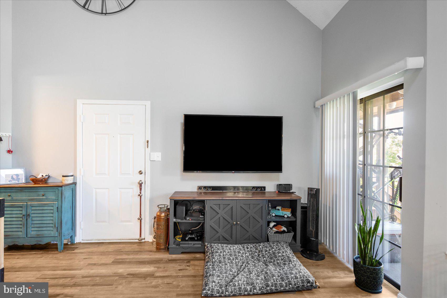 14105 William Street, Unit 15C Laurel, MD 20707 - Photo 14 of 24 a living room with furniture and a flat screen tv