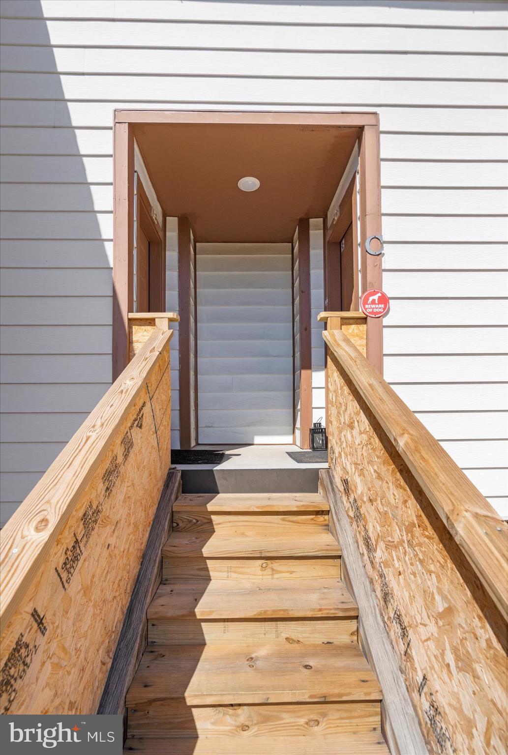 14105 William Street, Unit 15C Laurel, MD 20707 - Photo 5 of 24 a view of staircase with railing and white walls