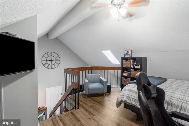 a view of a livingroom with furniture and a flat screen tv