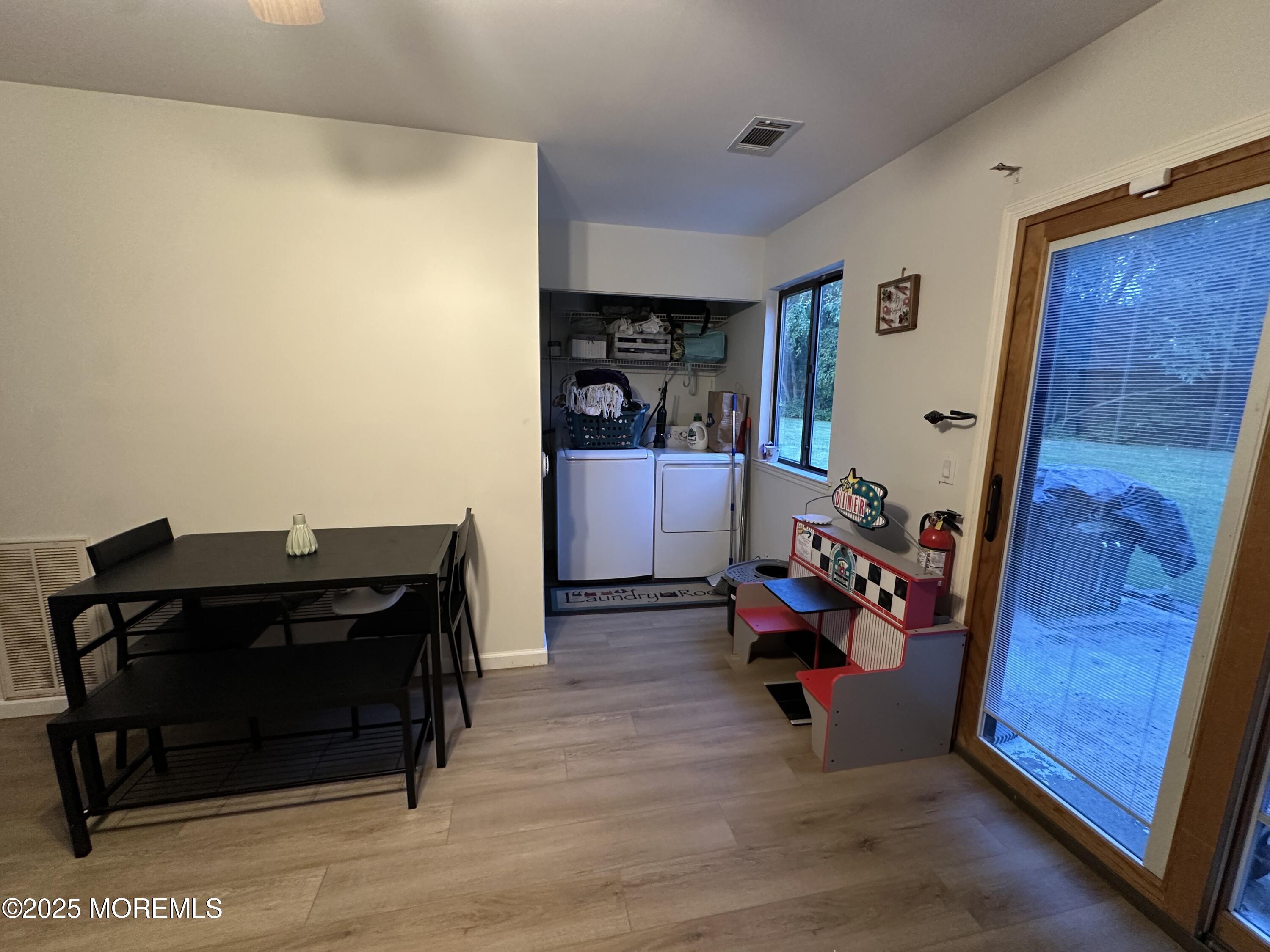 619 Sandra Place Brick, NJ 08724 - Photo 14 of 19 a living room with furniture and a wooden floor