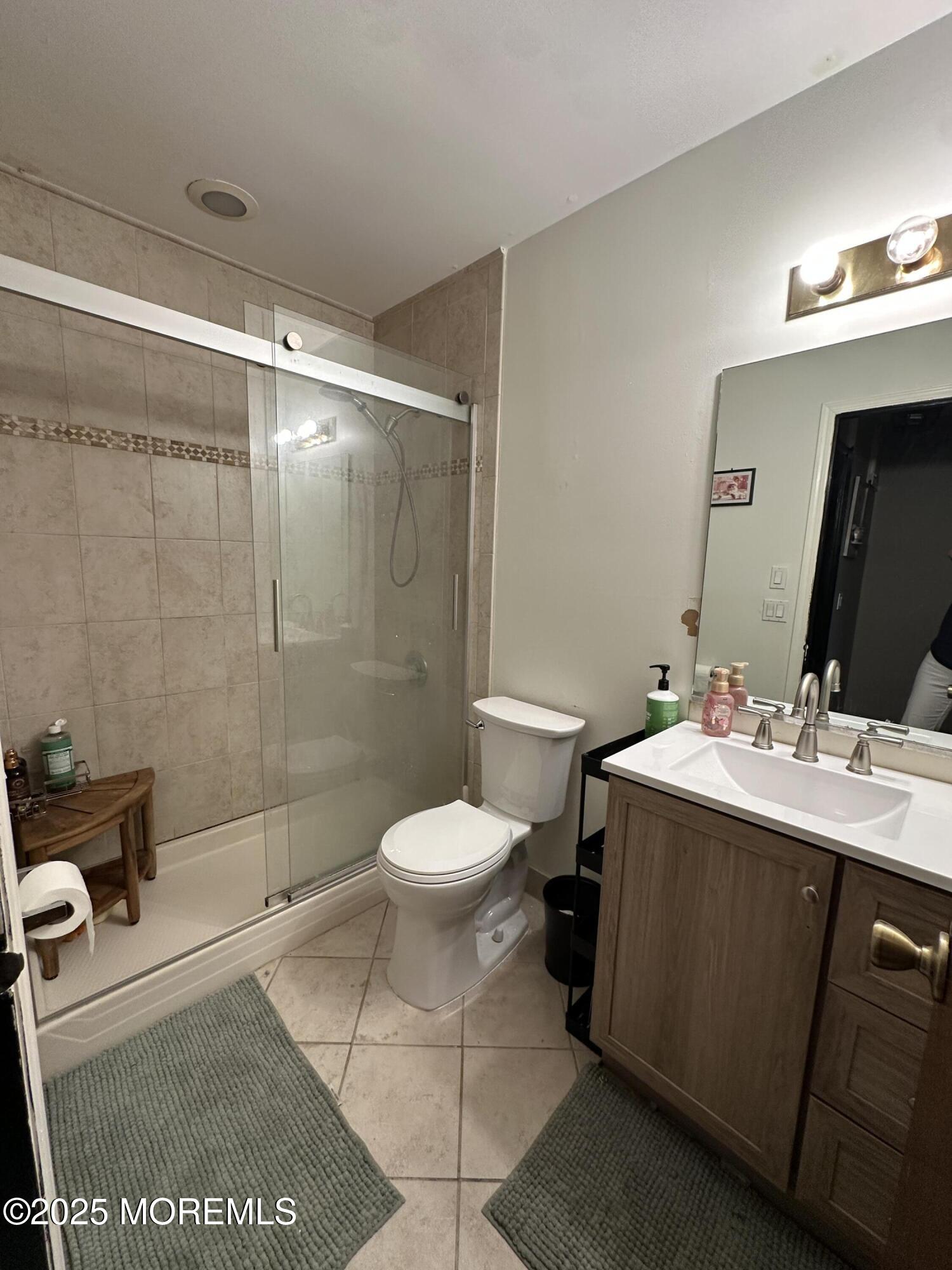 619 Sandra Place Brick, NJ 08724 - Photo 18 of 19 a bathroom with a sink toilet and shower