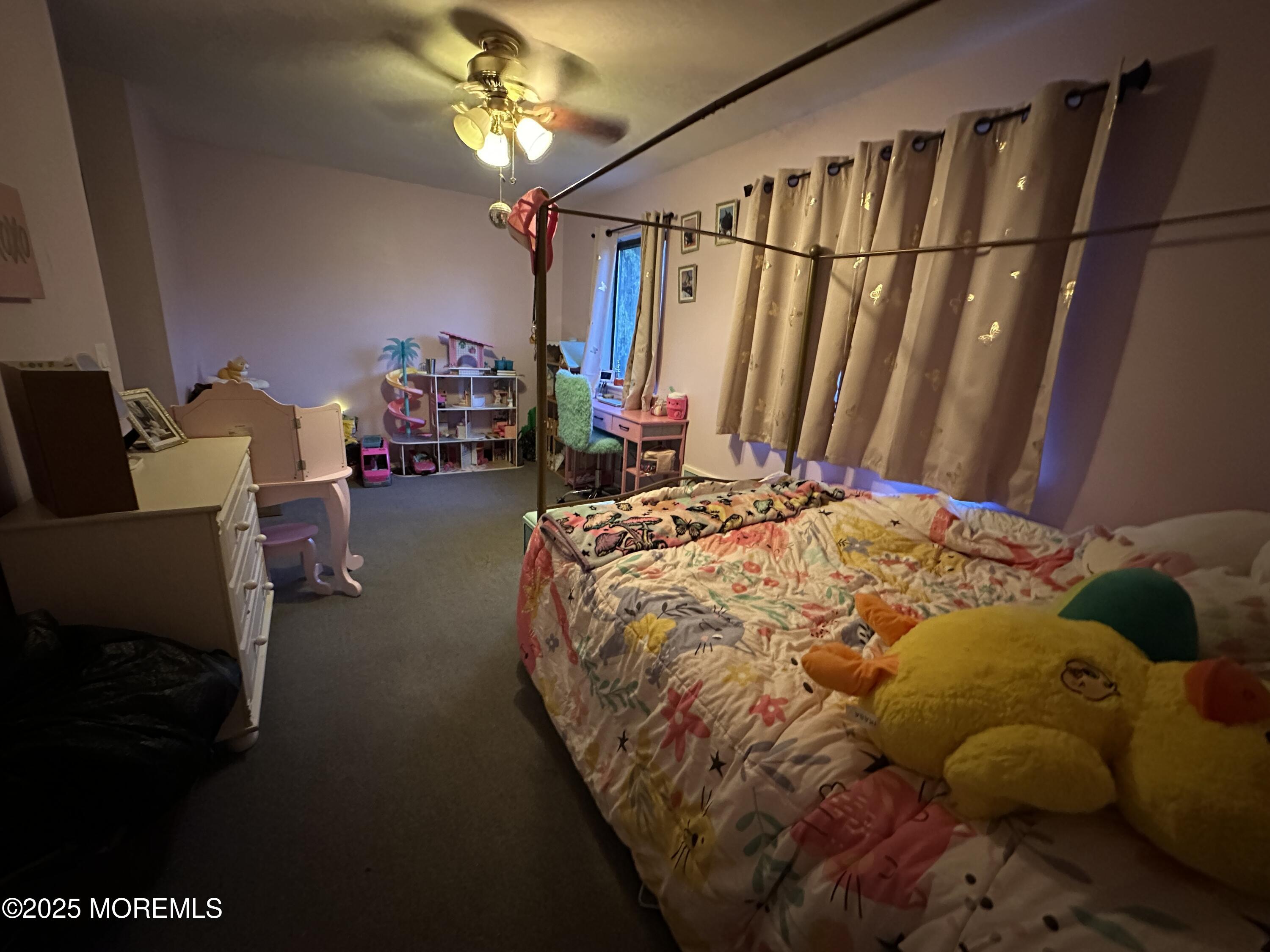 619 Sandra Place Brick, NJ 08724 - Photo 19 of 19 a bed sitting in a room next to a window