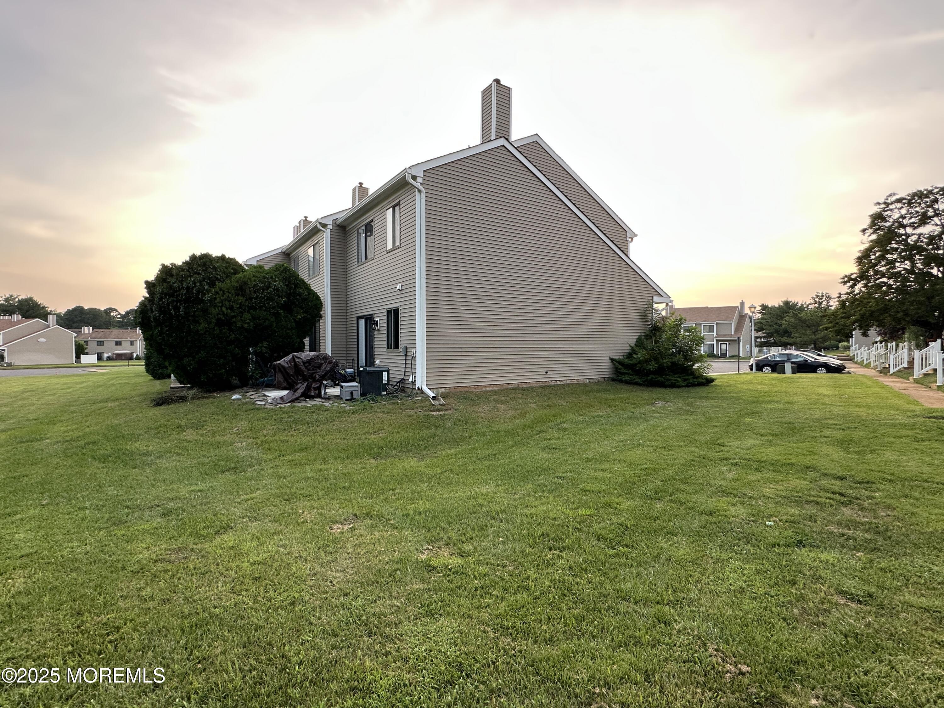 619 Sandra Place Brick, NJ 08724 - Photo 7 of 19 a backyard of a house with lots of green space