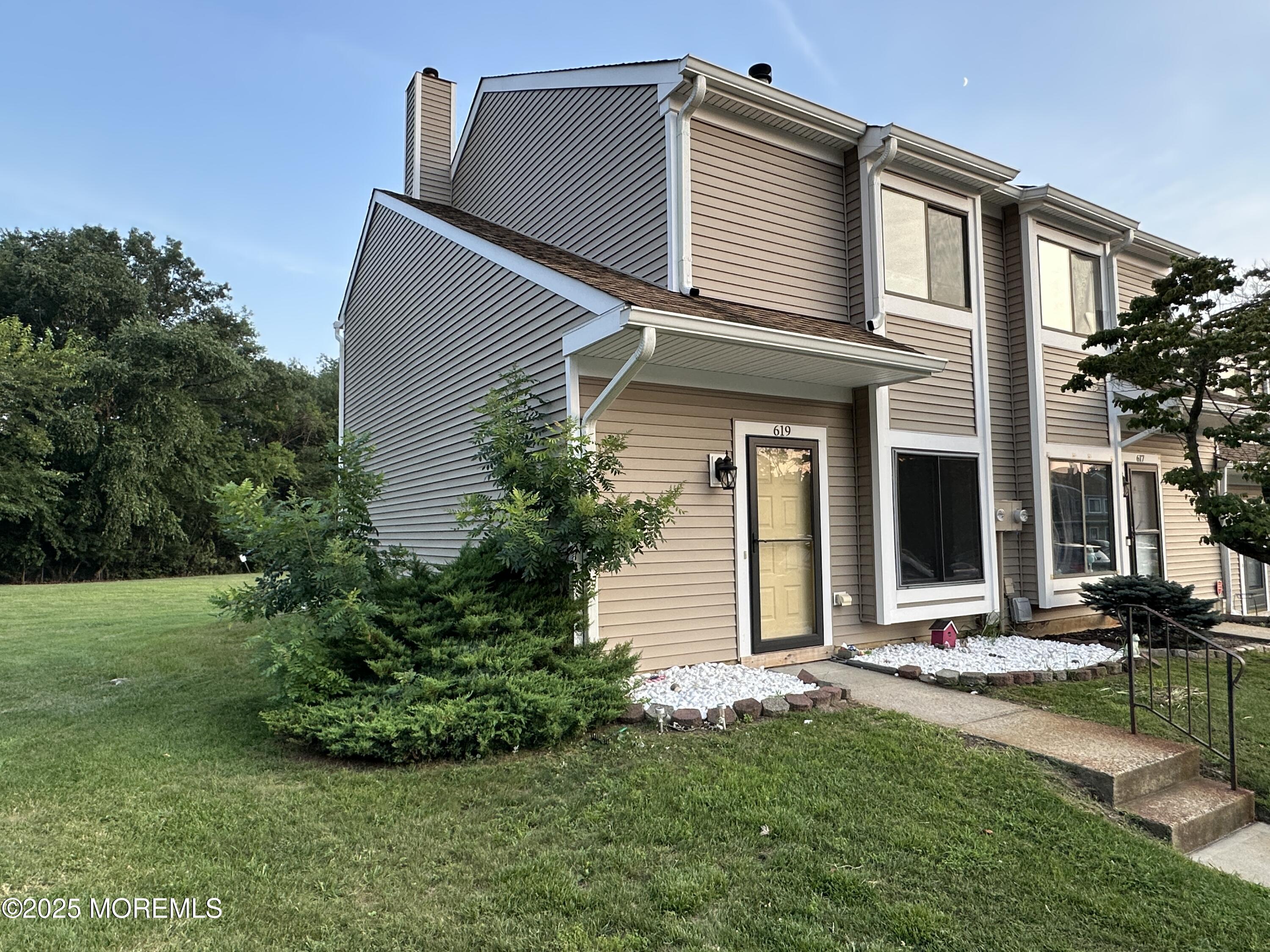 619 Sandra Place Brick, NJ 08724 - Photo 8 of 19 front view of a house with a yard