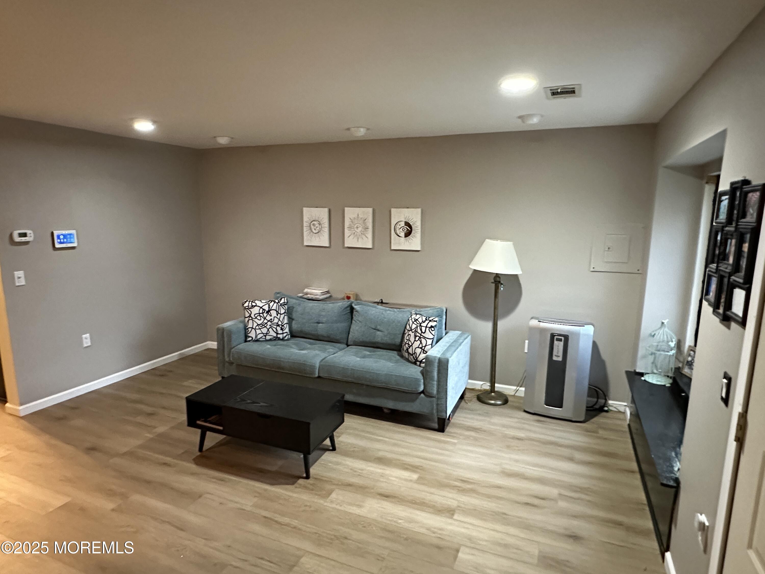 619 Sandra Place Brick, NJ 08724 - Photo 9 of 19 a living room with furniture and a wooden floor