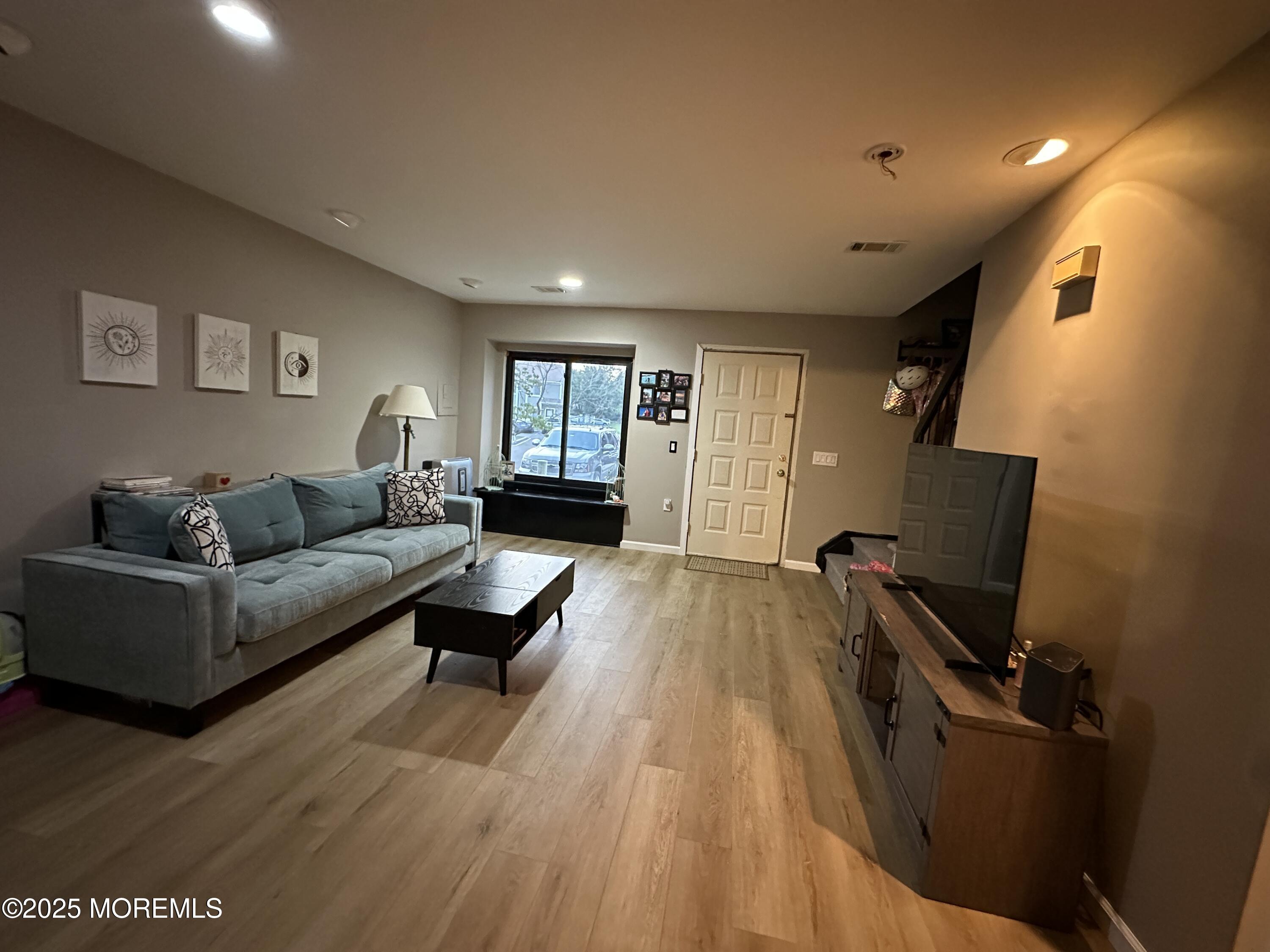 619 Sandra Place Brick, NJ 08724 - Photo 10 of 19 a living room with furniture and a wooden floor