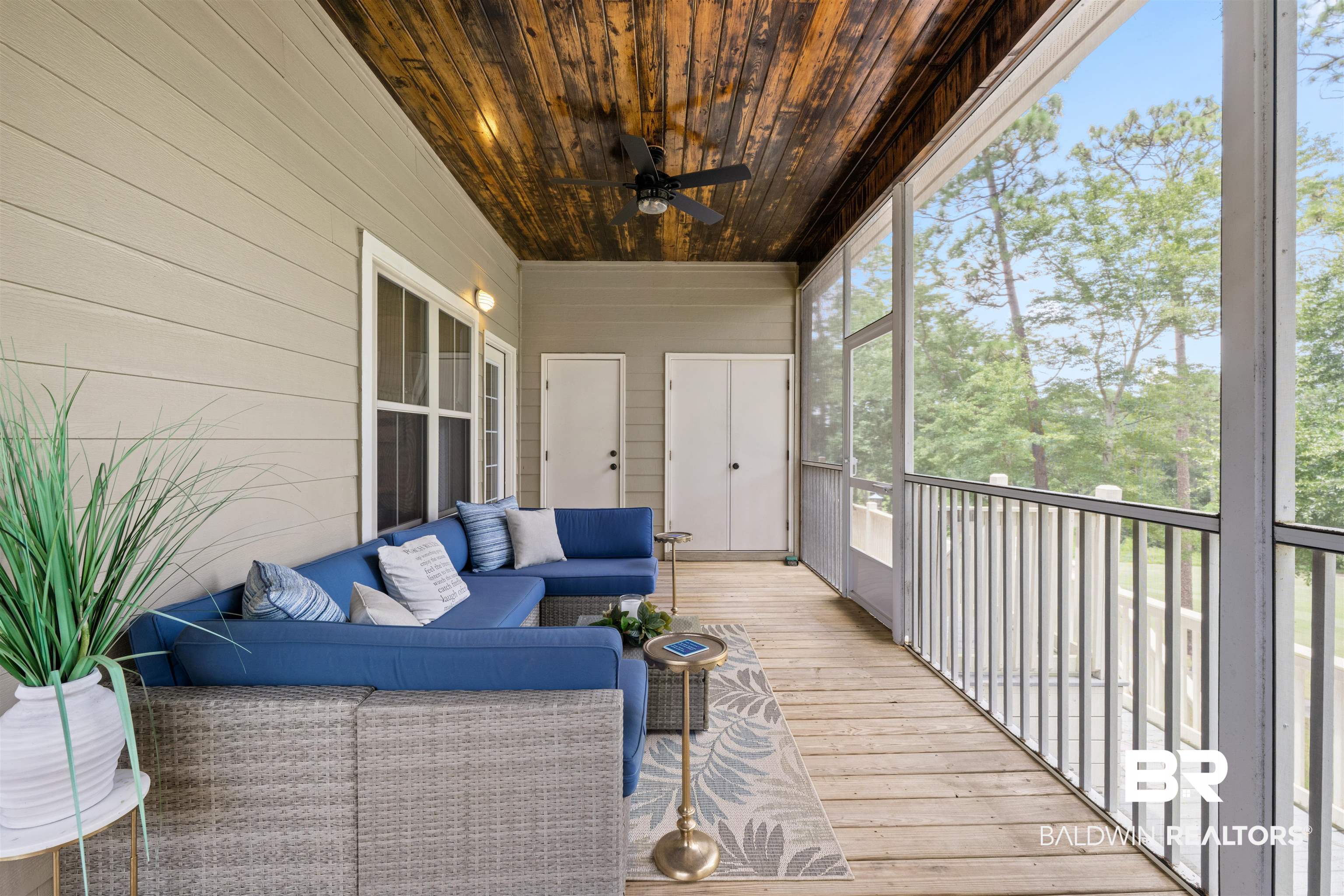 32700 Steelwood Ridge Road, Unit D Loxley, AL 36551 - Photo 28 of 41 Screened porch featuring a wood-finish plank ceiling, ceiling fan, and wood-finish flooring