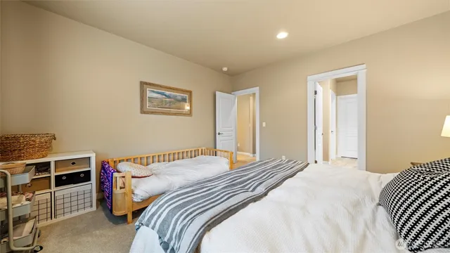 a roof deck with couches and potted plants
