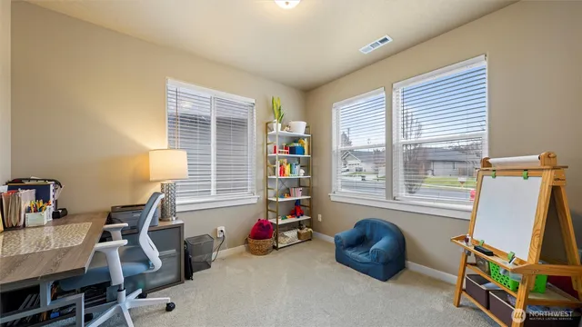 a room with lounge chair and a window