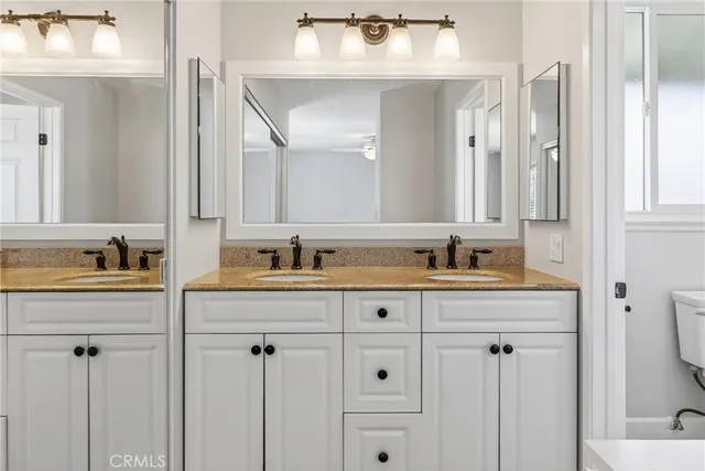 a bathroom with cabinets and sink