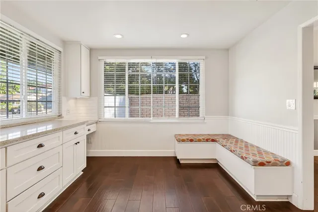 a bathroom with a bathtub a sink and a window