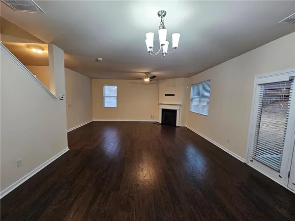 a kitchen with stainless steel appliances kitchen island granite countertop a refrigerator a stove and a sink