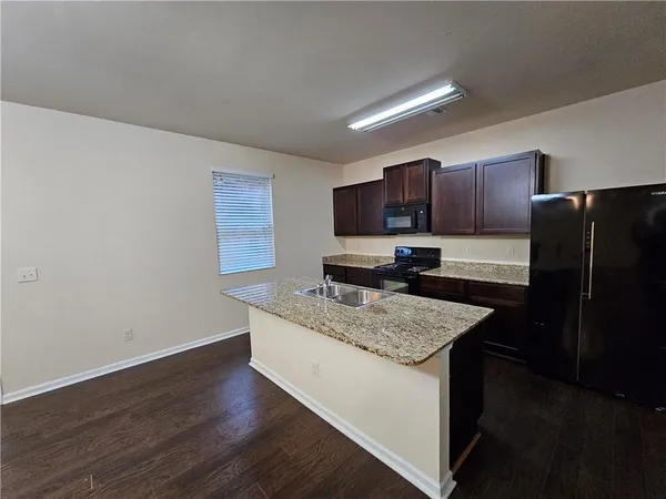 a view of a kitchen and dining room