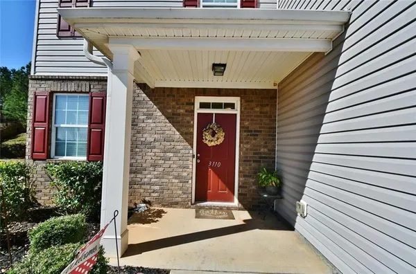 a front view of a house with yard