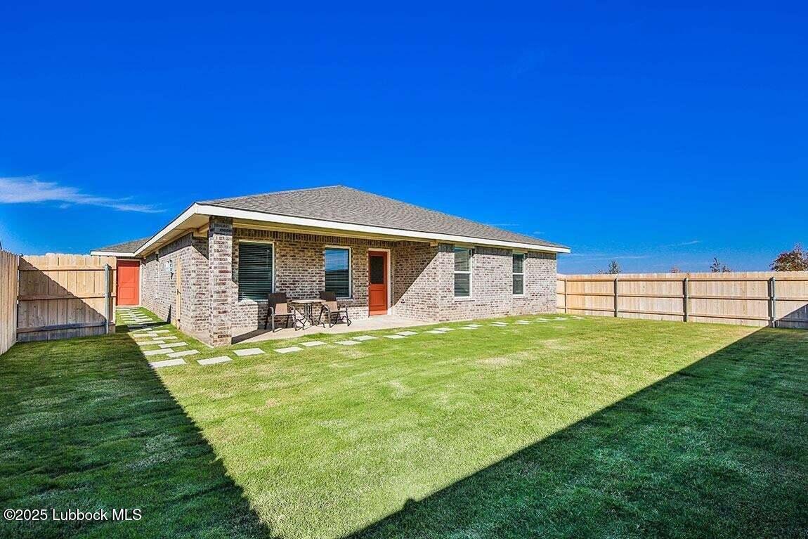 324 Ranger Street Wolfforth, TX 79382 - Photo 11 of 12 a view of a house with a backyard