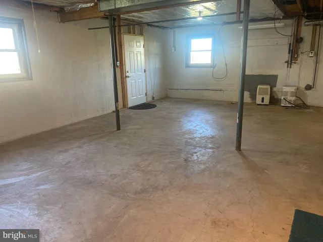 a backyard of a house with large trees