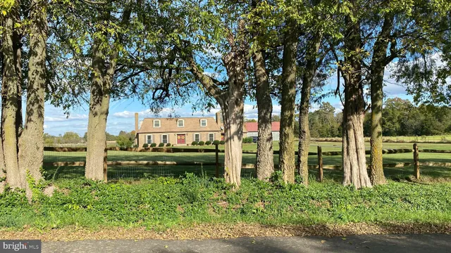 a front view of a house with many windows