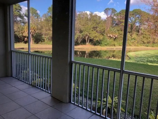 a view of a balcony with wooden floor
