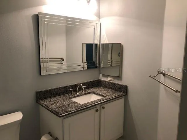 a view of a swimming pool with a yard