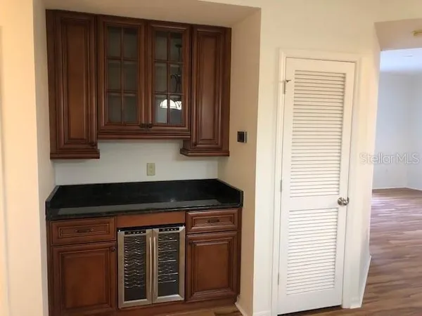 a kitchen with a stove and a cabinet
