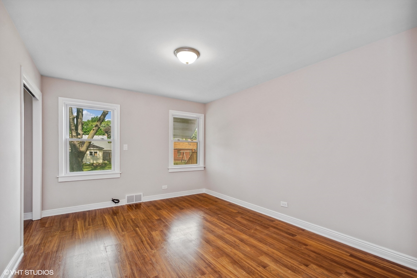 1816 North Nordica Avenue Chicago, IL 60707 - Photo 11 of 23 an empty room with wooden floor and window