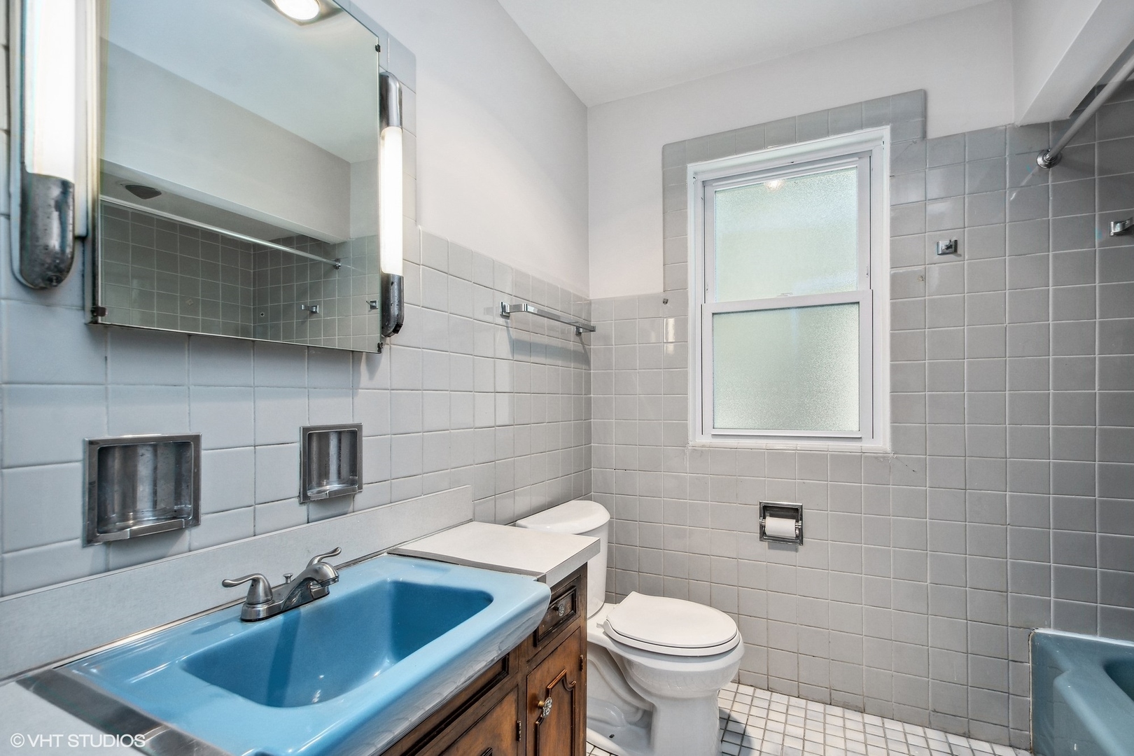 1816 North Nordica Avenue Chicago, IL 60707 - Photo 12 of 23 a bathroom with a sink a toilet and mirror